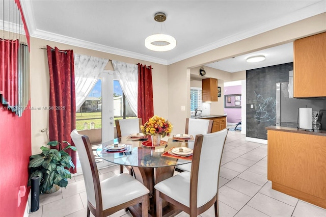 dining space featuring light tile patterned flooring and crown molding