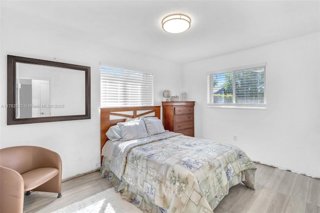 bedroom featuring wood finished floors