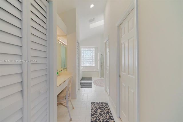 full bathroom featuring visible vents, recessed lighting, a bath, tile patterned floors, and vanity