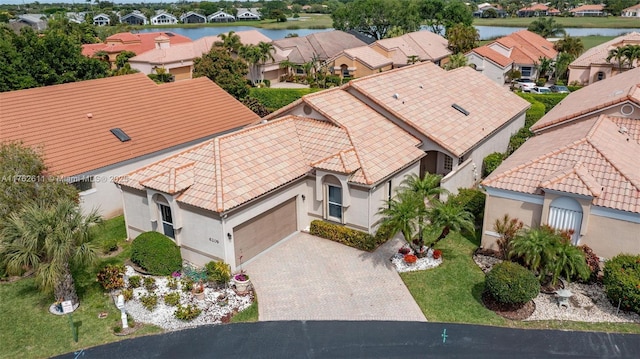 bird's eye view with a residential view and a water view