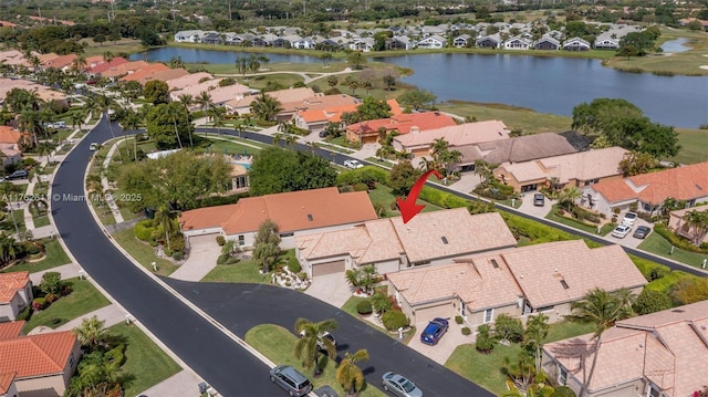 aerial view with a residential view and a water view