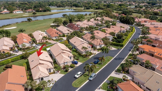 aerial view with a residential view and a water view