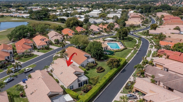 bird's eye view with a residential view and a water view