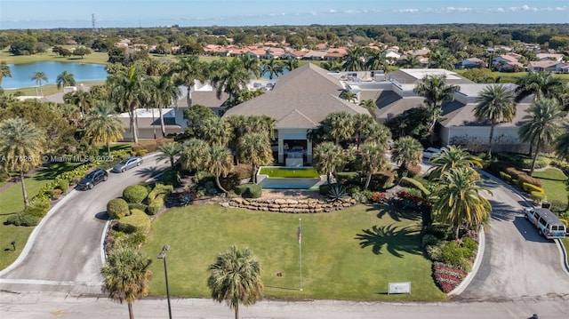 drone / aerial view featuring a water view and a residential view