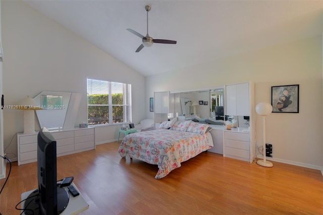 bedroom with baseboards, high vaulted ceiling, ceiling fan, and light wood finished floors