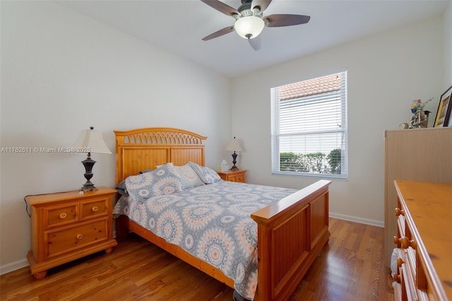 bedroom featuring light wood-type flooring, baseboards, and ceiling fan