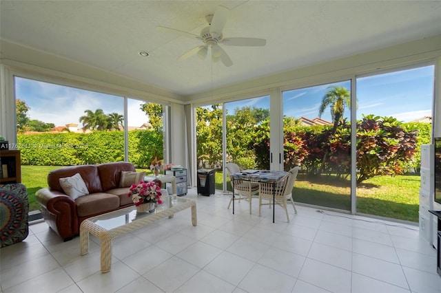 sunroom featuring a ceiling fan