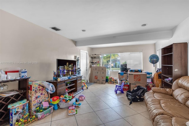 tiled living area featuring visible vents