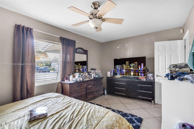 bedroom with ceiling fan and light tile patterned flooring