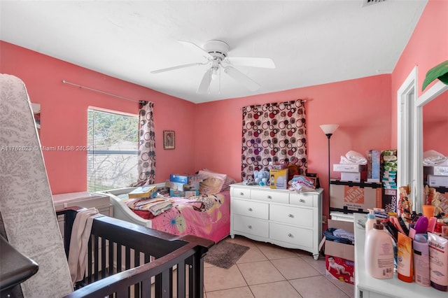 bedroom with light tile patterned flooring and ceiling fan