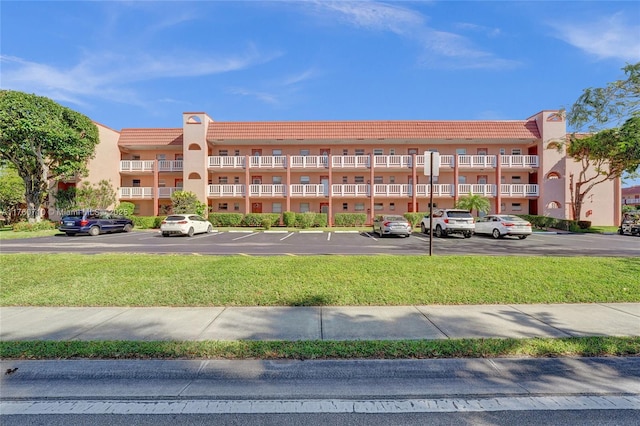 view of property featuring uncovered parking