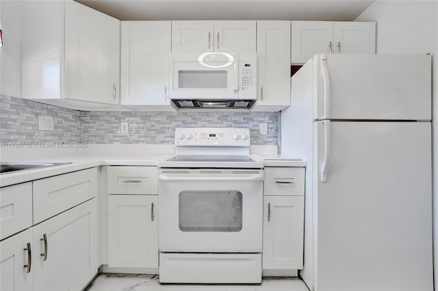 kitchen with white appliances, marble finish floor, white cabinets, and light countertops