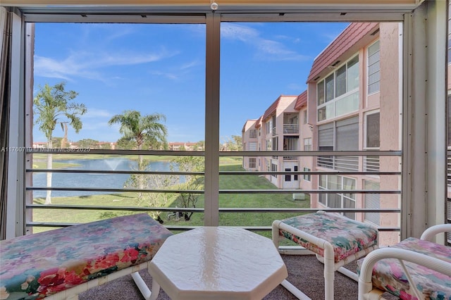 balcony featuring a water view