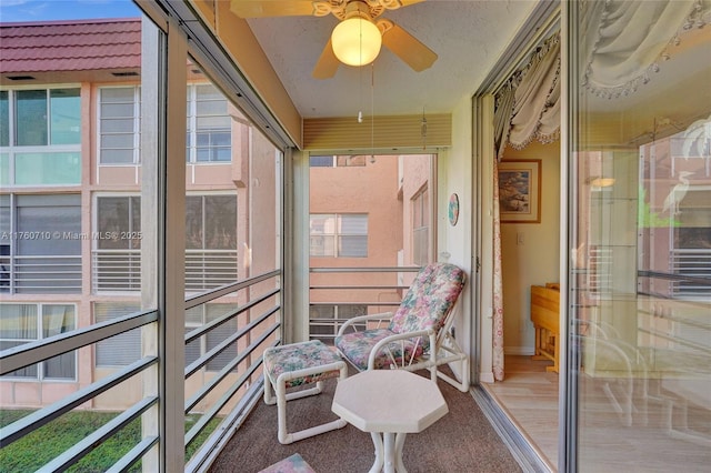 balcony featuring a ceiling fan