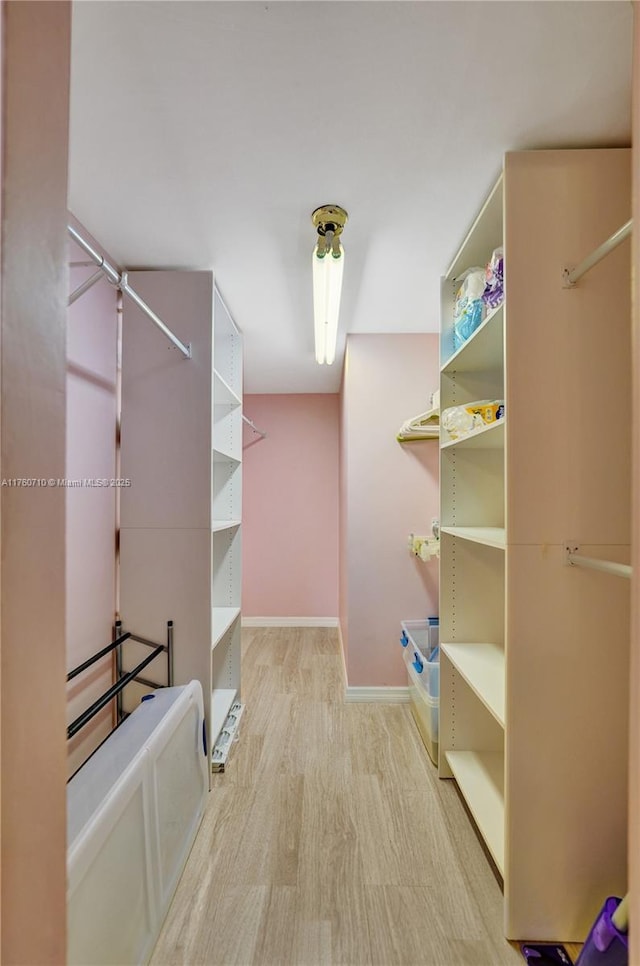 walk in closet featuring light wood-type flooring