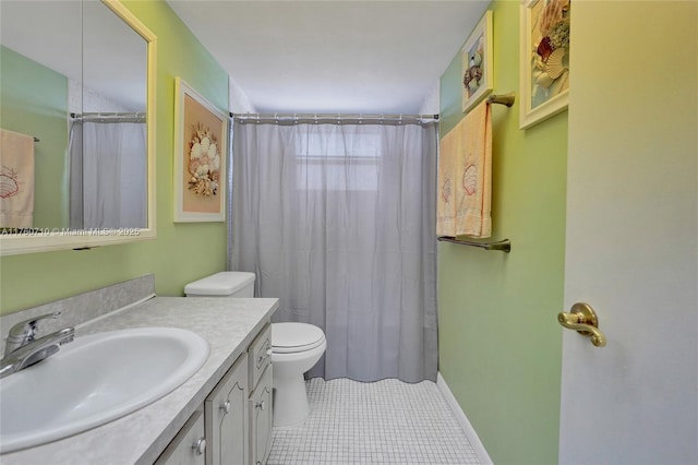 full bath with tile patterned flooring, curtained shower, baseboards, toilet, and vanity