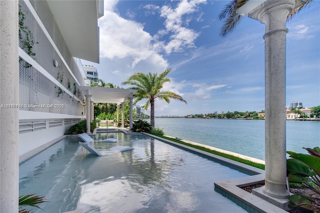 view of swimming pool with a water view