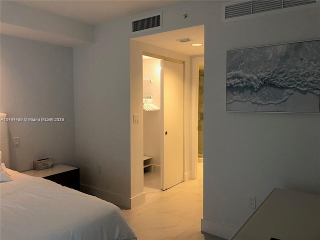 bedroom with visible vents and marble finish floor