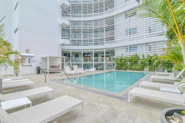 community pool featuring a patio