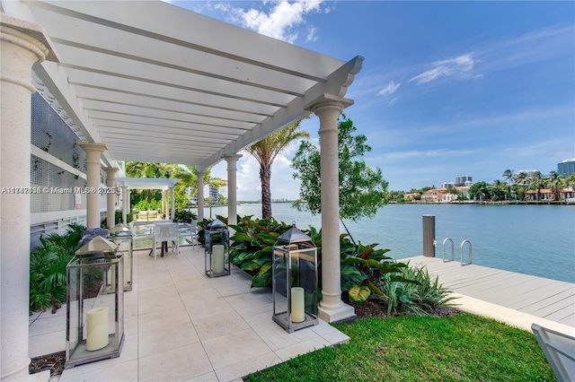 view of patio featuring a dock, a pergola, and a water view