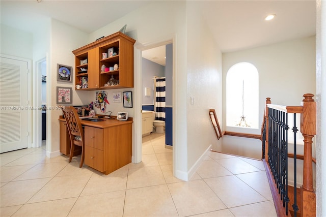 hall featuring an upstairs landing, recessed lighting, baseboards, and light tile patterned flooring