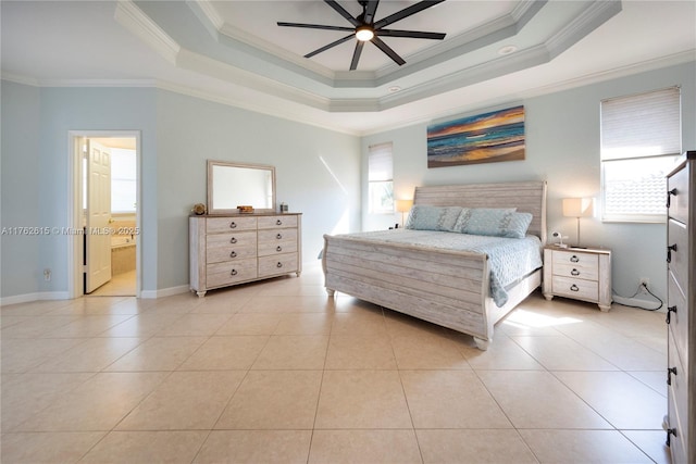 bedroom with light tile patterned floors, baseboards, a tray ceiling, ceiling fan, and crown molding