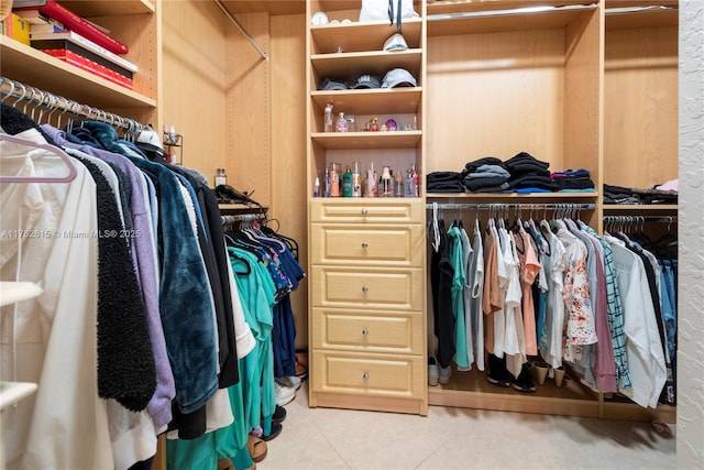 spacious closet with tile patterned floors