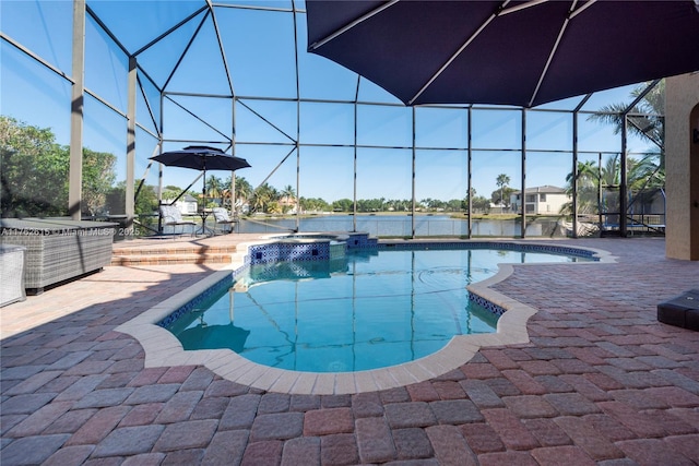 view of pool with glass enclosure, a patio area, and a pool with connected hot tub