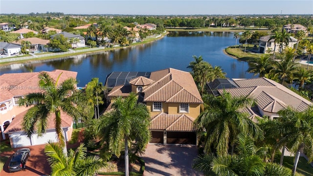 bird's eye view with a residential view and a water view