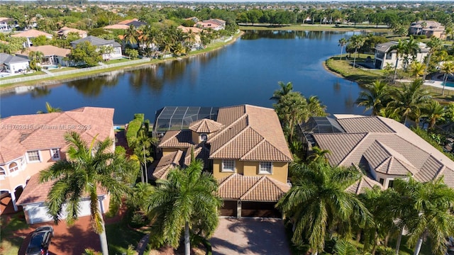 drone / aerial view with a residential view and a water view