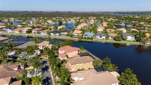 bird's eye view with a residential view and a water view