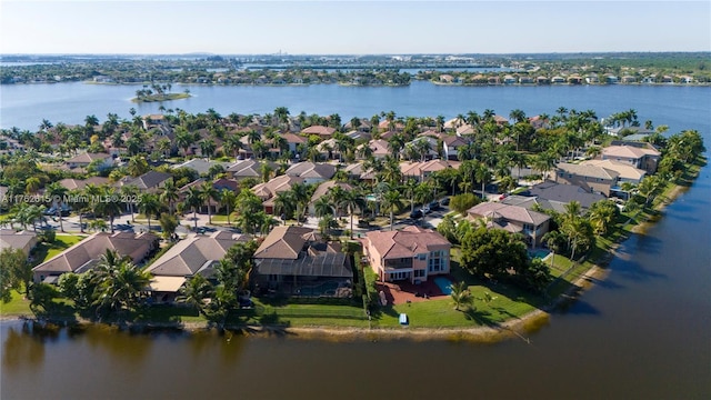 bird's eye view with a residential view and a water view