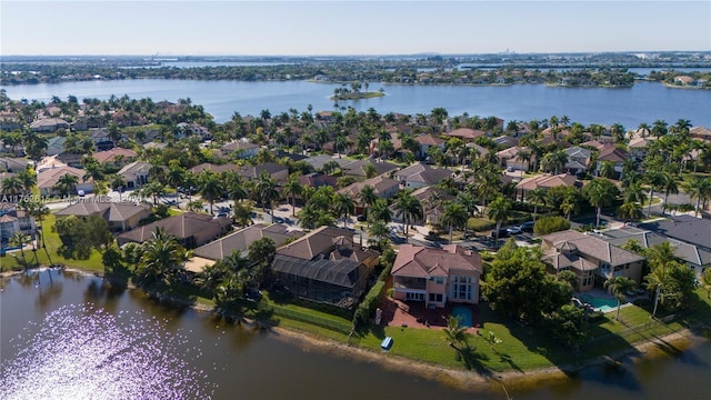 bird's eye view with a residential view and a water view