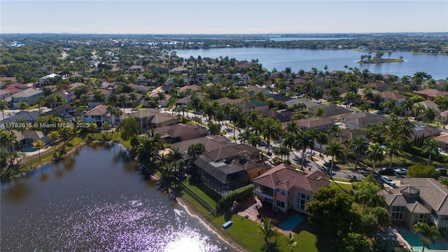 aerial view with a residential view and a water view