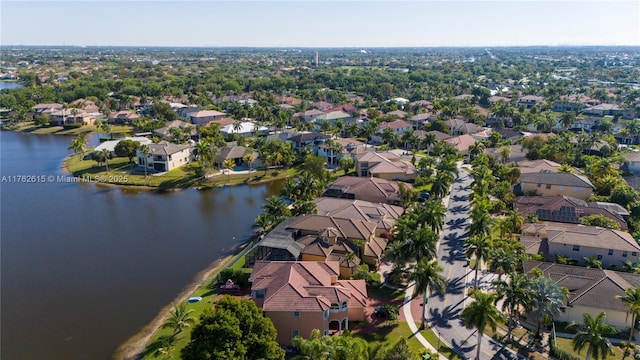 birds eye view of property with a residential view and a water view