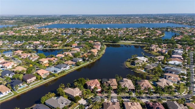 birds eye view of property with a residential view and a water view