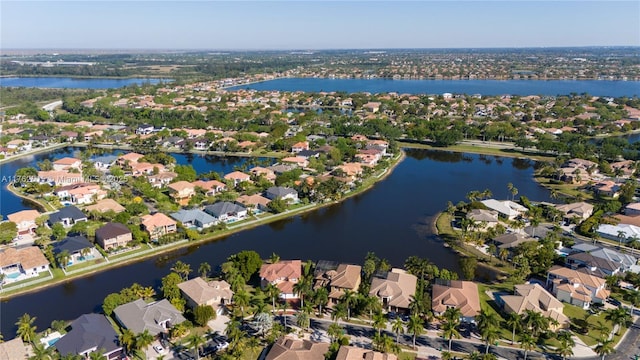 birds eye view of property featuring a residential view and a water view