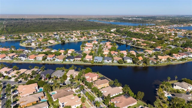 birds eye view of property with a residential view and a water view