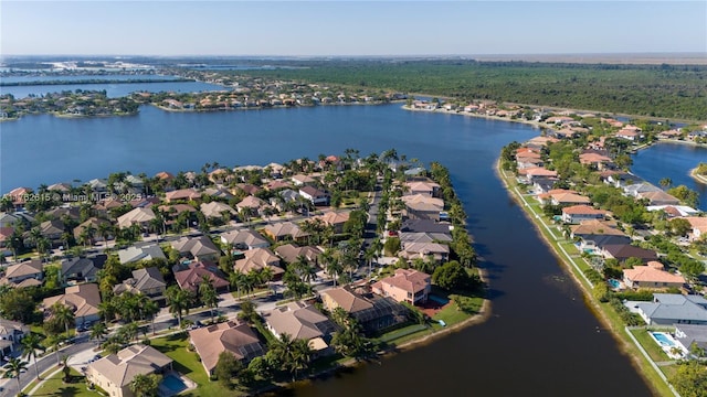 birds eye view of property featuring a residential view and a water view