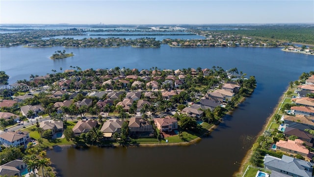 aerial view with a residential view and a water view