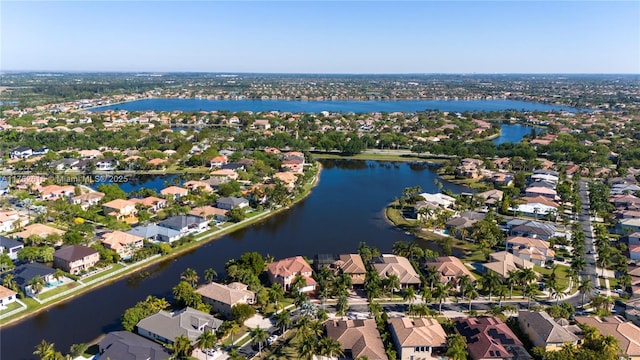 bird's eye view featuring a residential view and a water view