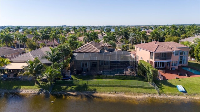 drone / aerial view with a water view and a residential view