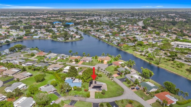 birds eye view of property featuring a residential view and a water view