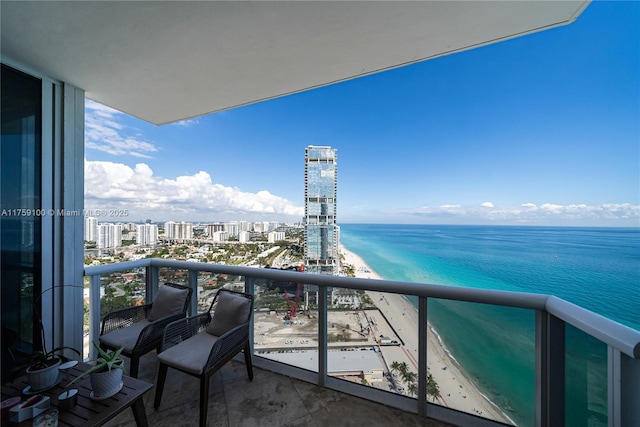 balcony featuring a view of city and a water view