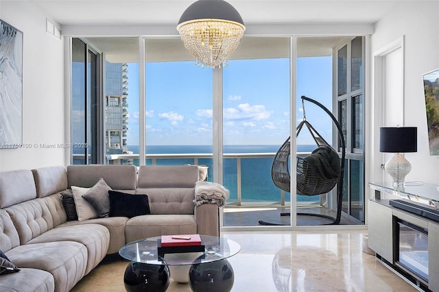 18201 Collins Ave Unit 4404, Sunny Isles Beach, FL 33160 - living room with a wall of windows, a chandelier, and a water view