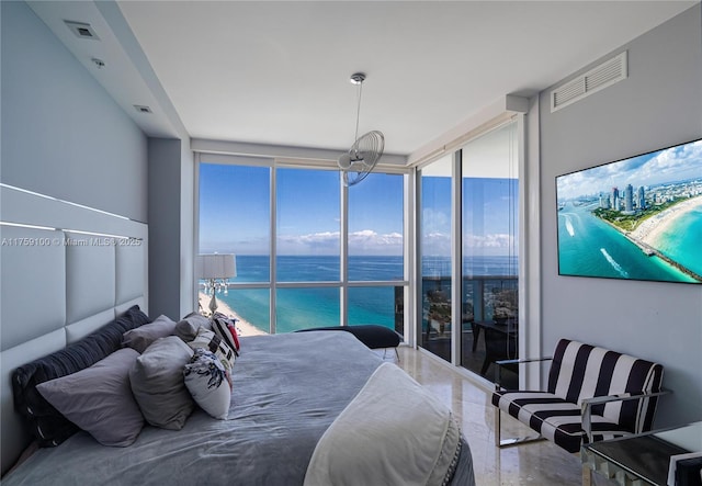 bedroom with visible vents and expansive windows