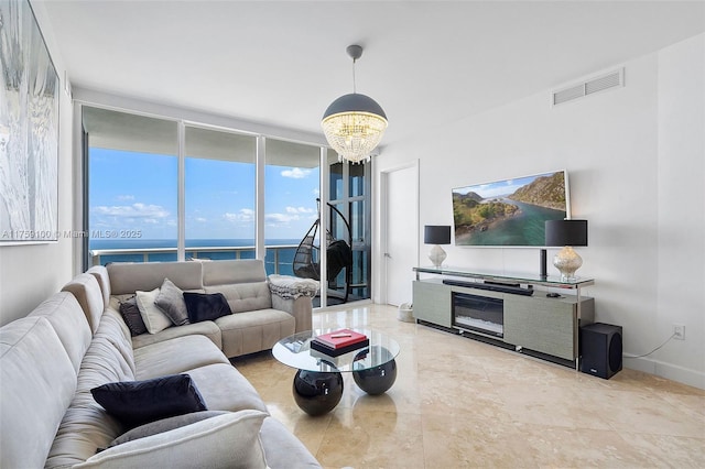 18201 Collins Ave Unit 4404, Sunny Isles Beach, FL 33160 - living room featuring a chandelier, floor to ceiling windows, baseboards, and tile patterned flooring