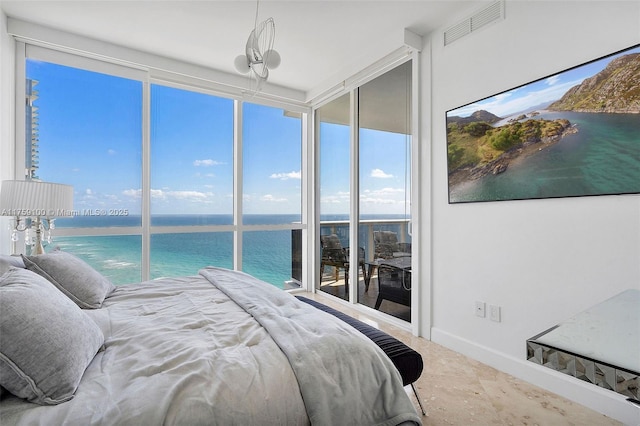 18201 Collins Ave Unit 4404, Sunny Isles Beach, FL 33160 - bedroom with baseboards and a wall of windows