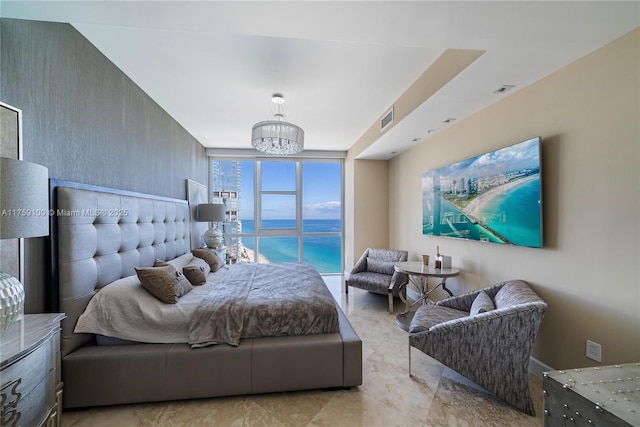 bedroom featuring visible vents and an inviting chandelier