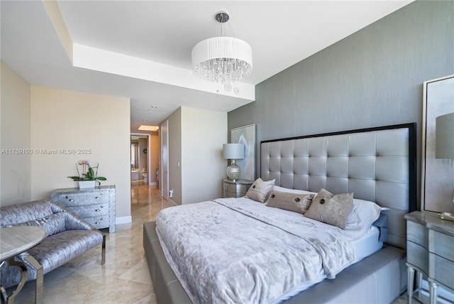 bedroom with baseboards, marble finish floor, and a chandelier